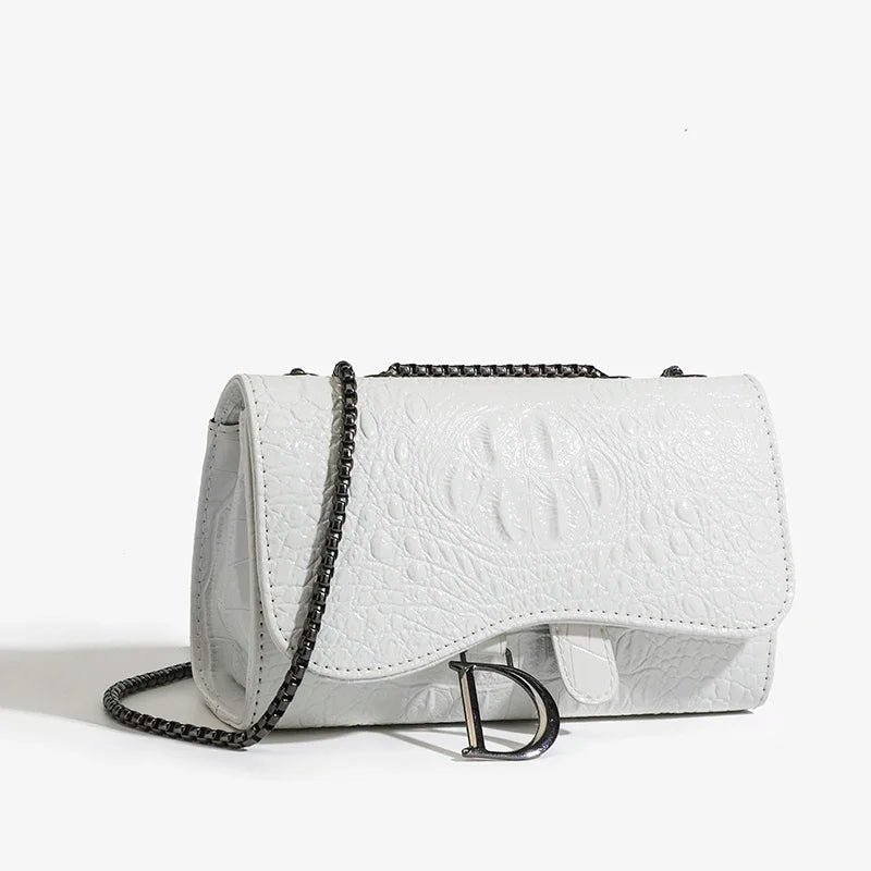 White textured handbag with a chain strap on a light gray background