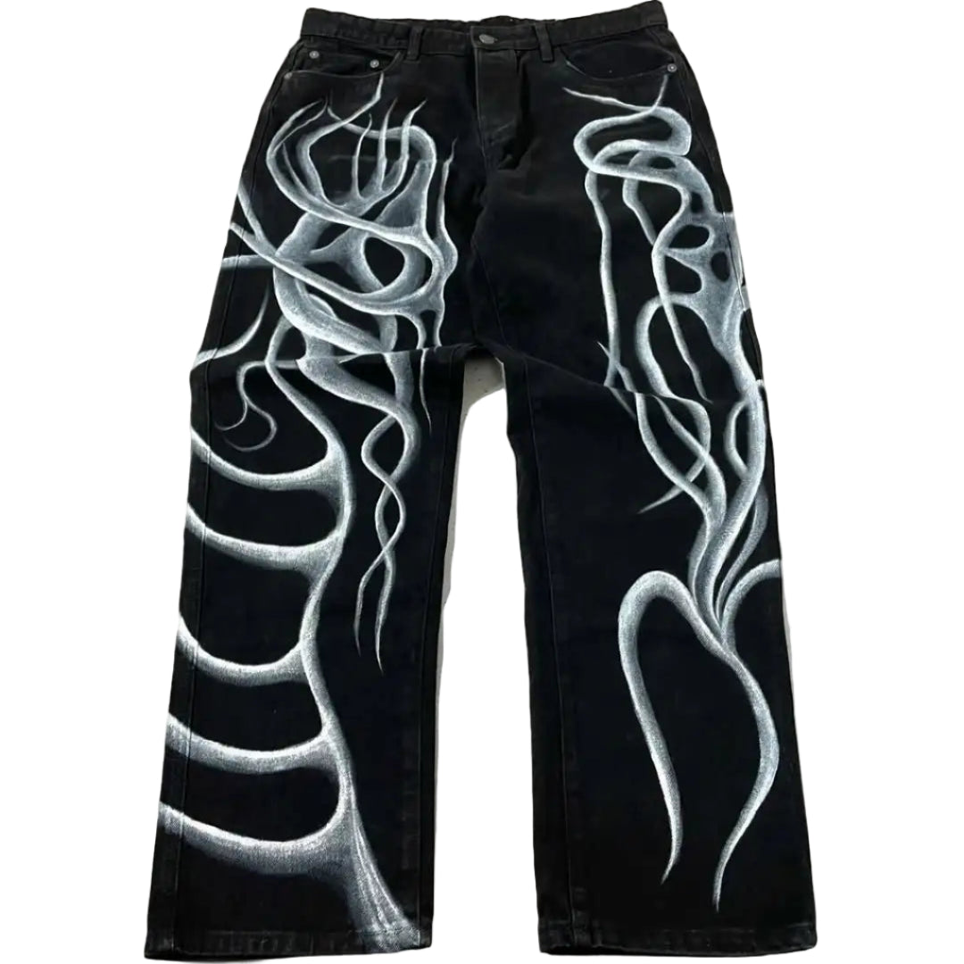 Black jeans with white flame designs on a light gray background