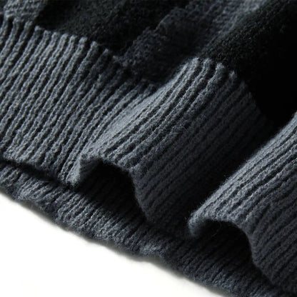 Close-up of dark gray knit fabric on a white background