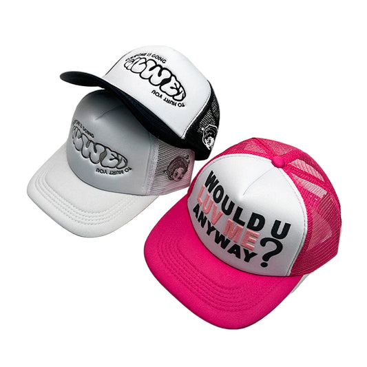 Two caps, one white with black text and one pink with white text, on a light gray background.