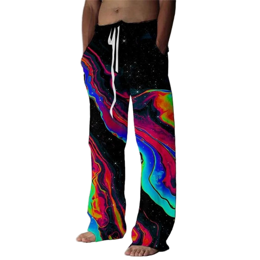 Person wearing colorful, tie-dye pants with a black background