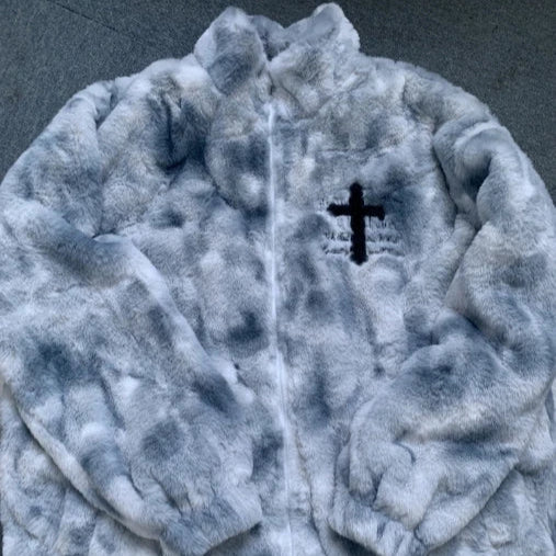 Gray fleece jacket with a black cross emblem on a dark background