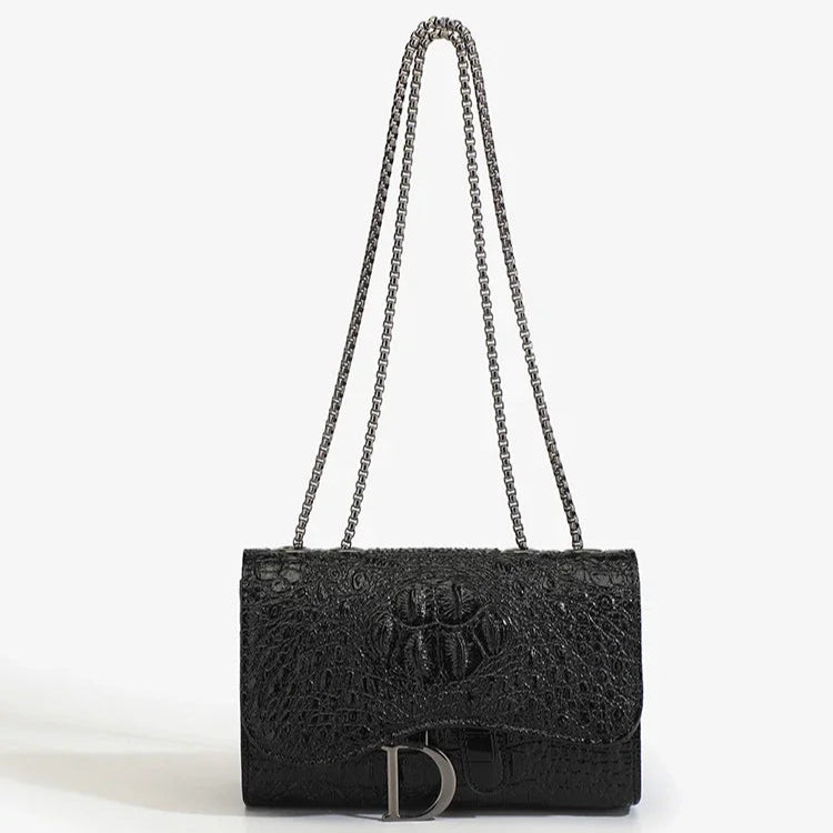 Black textured handbag with chain strap on a white background