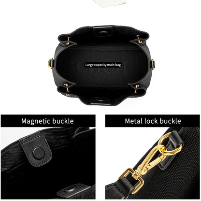 Black handbag with magnetic and metal lock buckles, displayed on a white background.