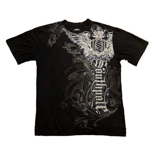 Black t-shirt with white intricate design on a textured gray surface
