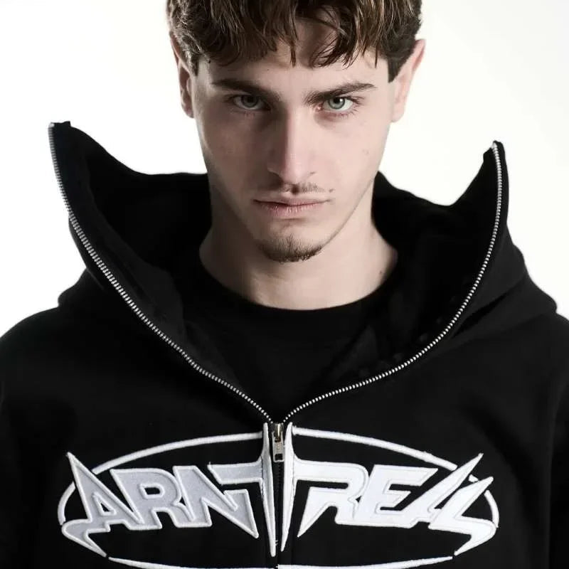 Man wearing a black hoodie with 'Arntreas' logo on a white background