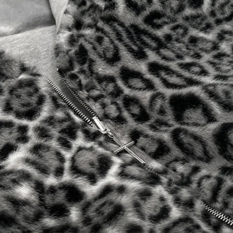 Close-up of a zipper on a leopard print fabric background