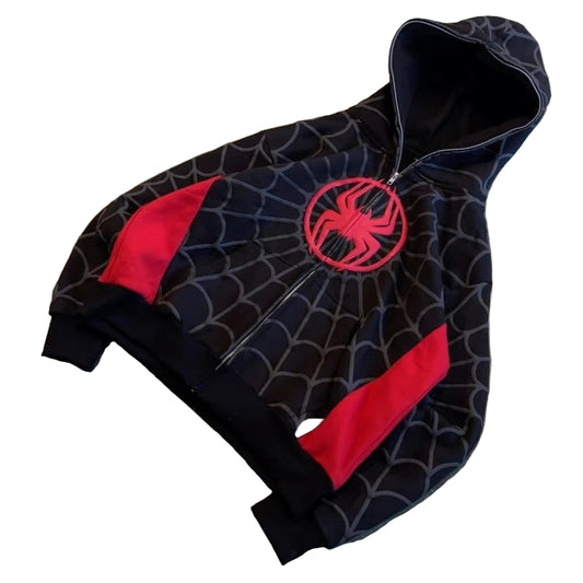 Black hoodie with red spider emblem on a textured surface