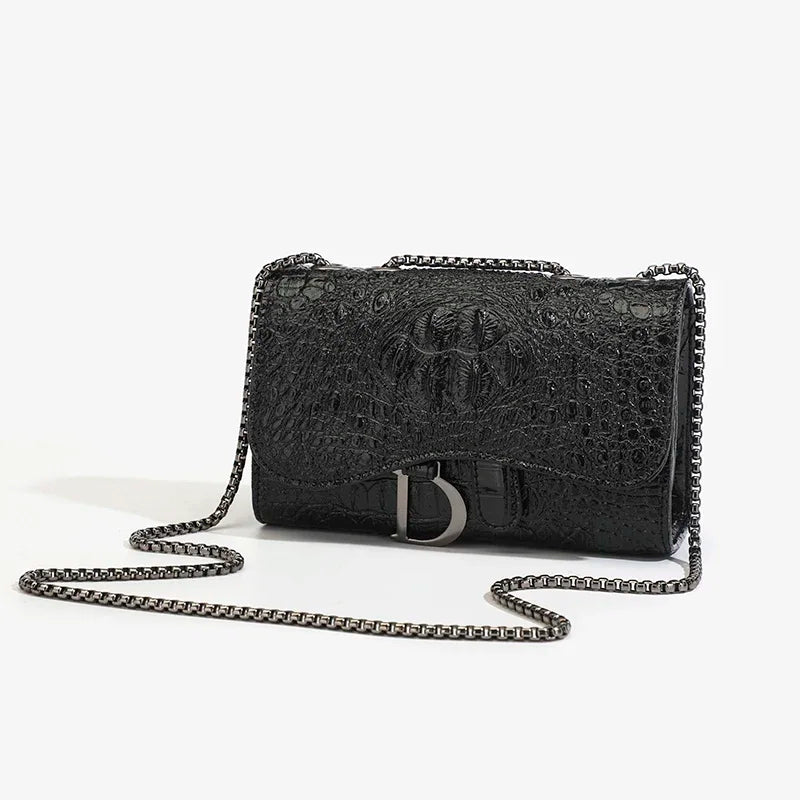 Black textured handbag with chain strap on a white background