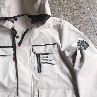 White hooded jacket with black accents on a gray floor