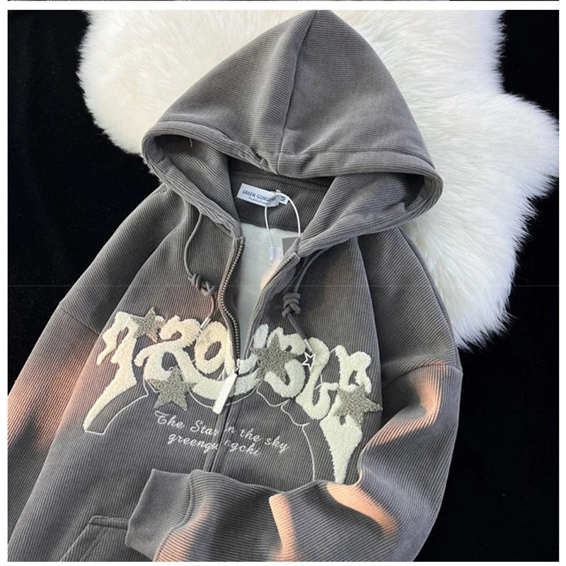 Gray hoodie with floral design and text on a white fur background