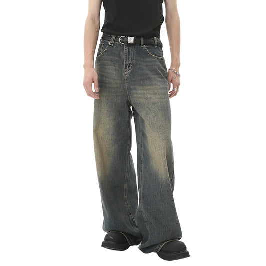 Person wearing wide-leg jeans with a visible brand logo on a white background