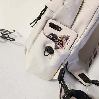 Phone case with design attached to a white bag on a light gray background