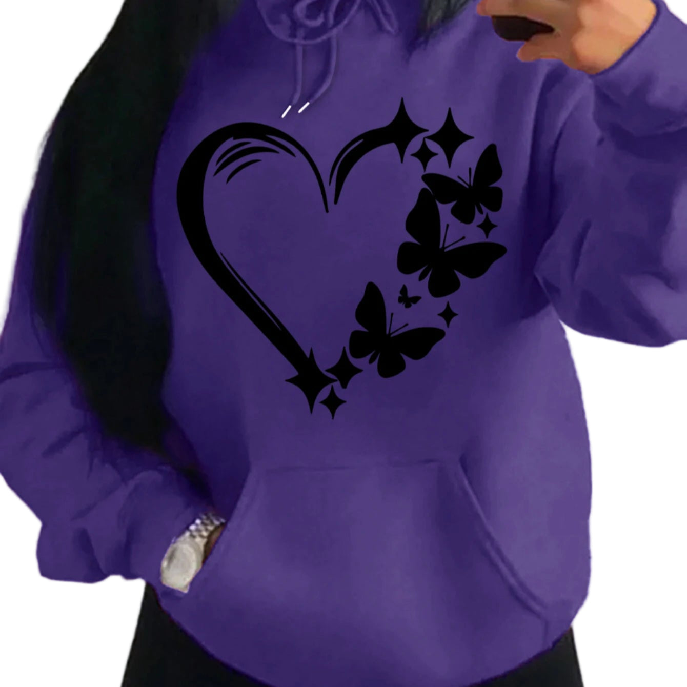Person wearing a purple hoodie with black butterfly design on a plain background