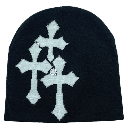 Black beanie with white cross patterns on a light gray background