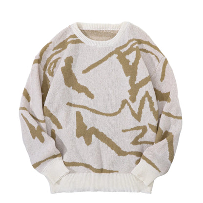 White sweater with brown abstract patterns on a white fur surface with a beige cap and black cup.