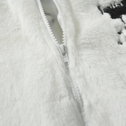 Close-up of a textured white fabric with a zipper