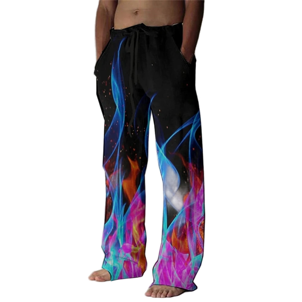 Person wearing colorful pants with flame design against a plain background