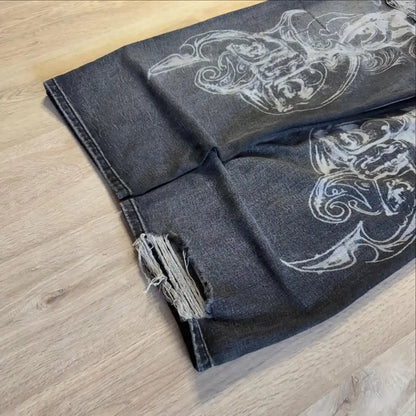 Dark denim fabric with white floral patterns on a wooden surface