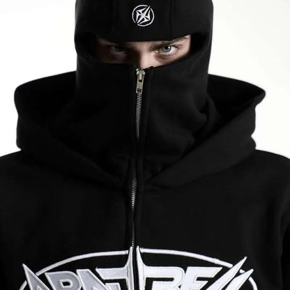 Person wearing a black hoodie with a logo on a white background
