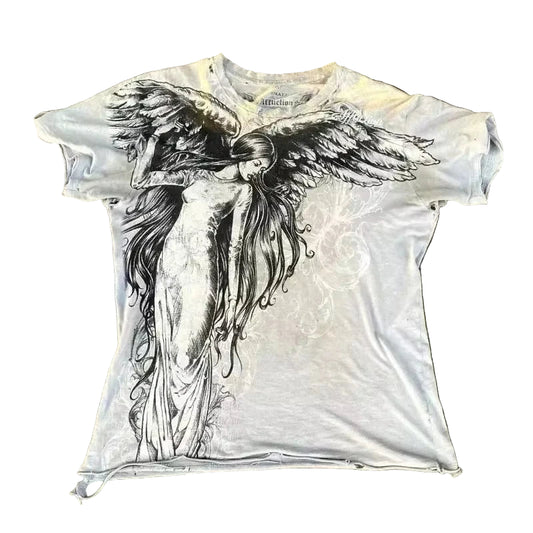 White t-shirt with an angel graphic design on a textured surface
