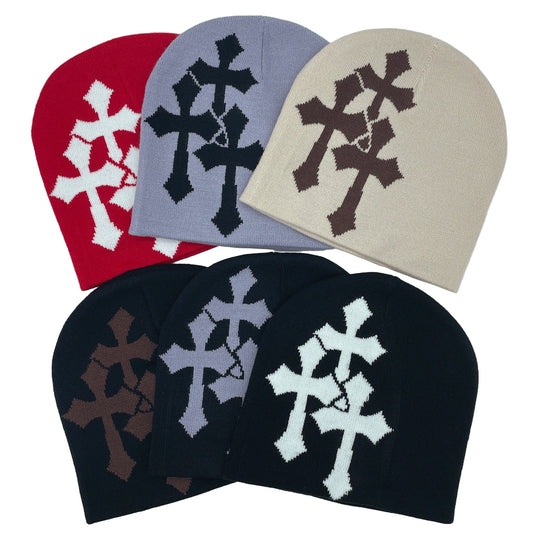 Set of beanies with cross patterns in various colors on a white background