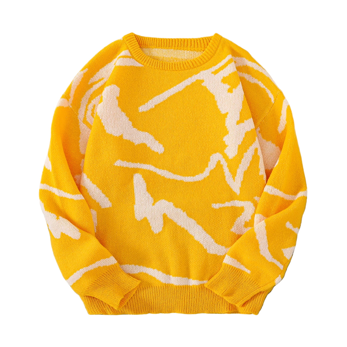 Yellow sweater with white patterns on a gray surface with sunglasses and a white box.