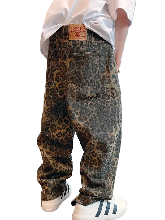 Person wearing leopard print pants with a plain background