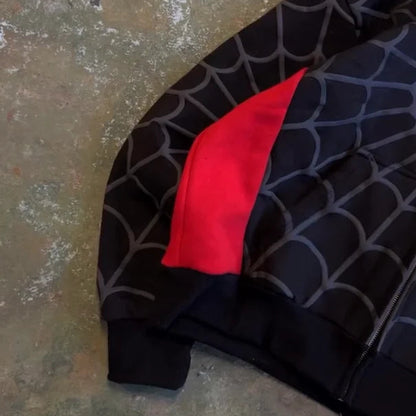 Black fabric with red accent on a textured surface
