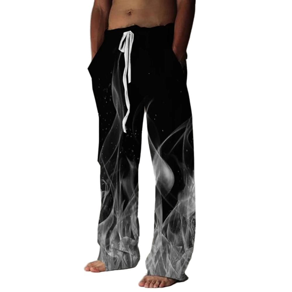 Person wearing black pants with white abstract design on a plain background