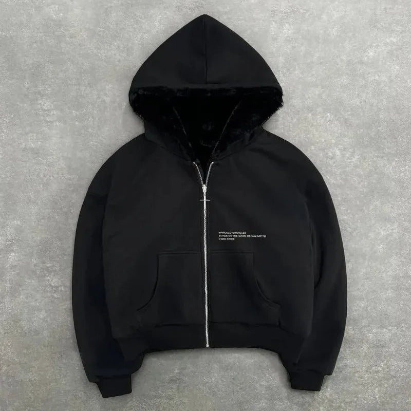 Black hoodie with a zipper on a gray background