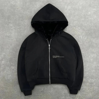 Black hoodie with a zipper on a gray background