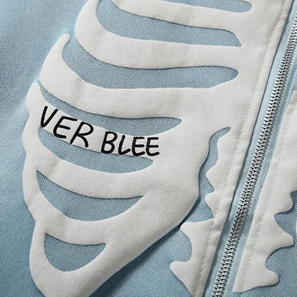 Close-up of a jacket with leaf patterns and 'VER BLEE' text on a light blue background