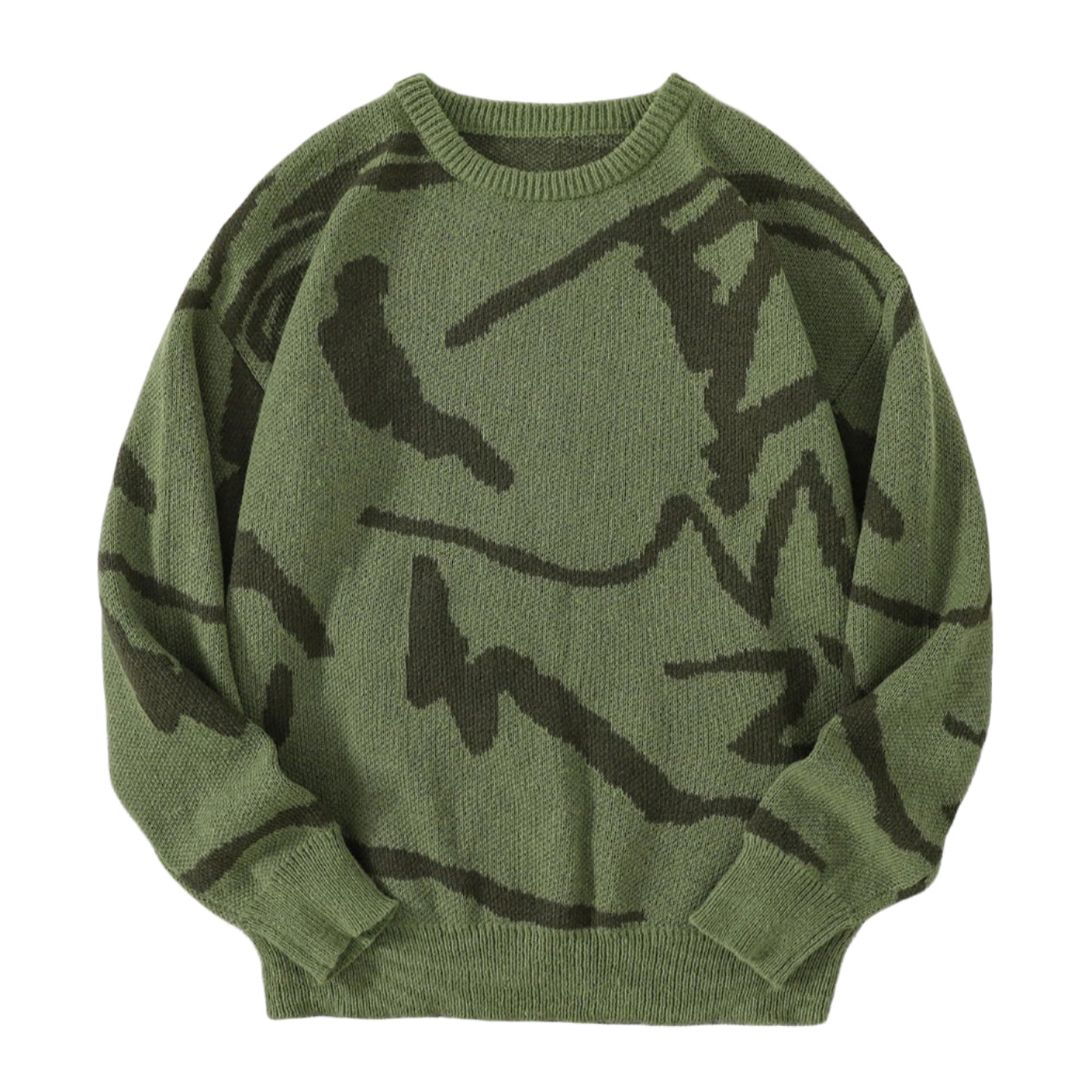 Green sweater with black abstract patterns on a gray surface with white sneakers and a white fluffy rug.