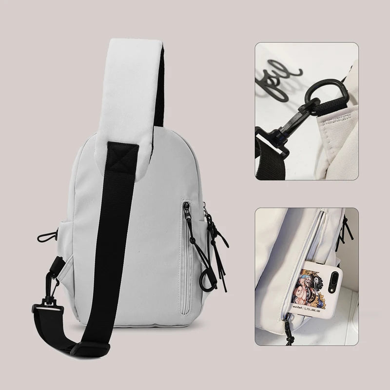 Light gray sling bag with black accents on a light gray background