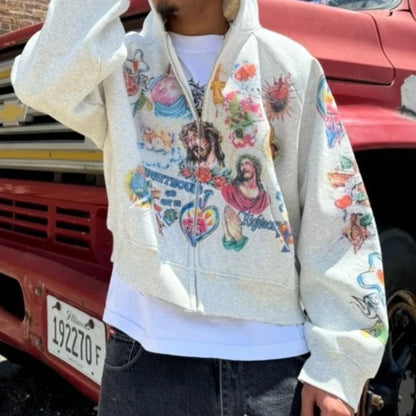 Person wearing a colorful graphic hoodie in front of a red vehicle