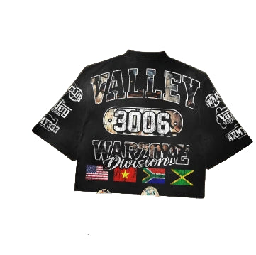 Black t-shirt with text and graphics on a textured surface