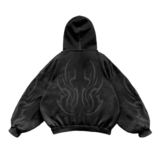 Black hoodie with a design on the back on a light gray tiled background