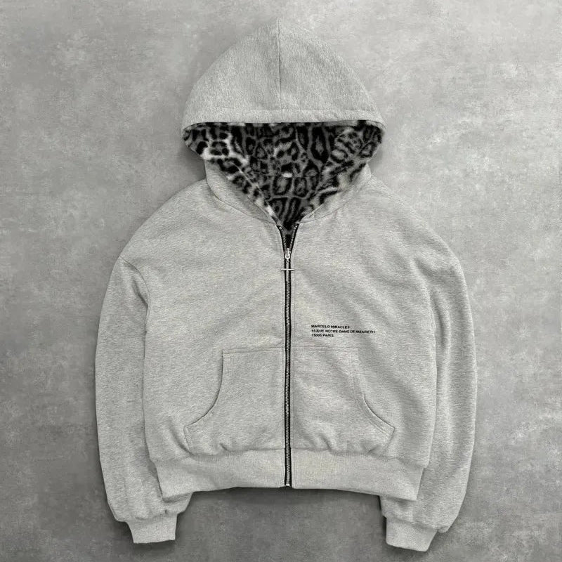 Gray hoodie with leopard print hood on a gray background