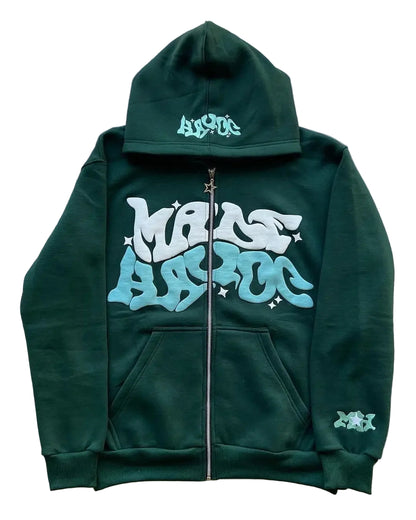 Green hoodie with white and light blue text on a gray surface