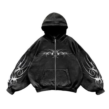 Black hoodie with white tribal designs on sleeves against a light gray background