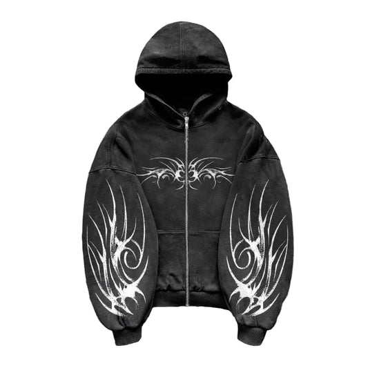 Black hoodie with white tribal designs on a textured gray background