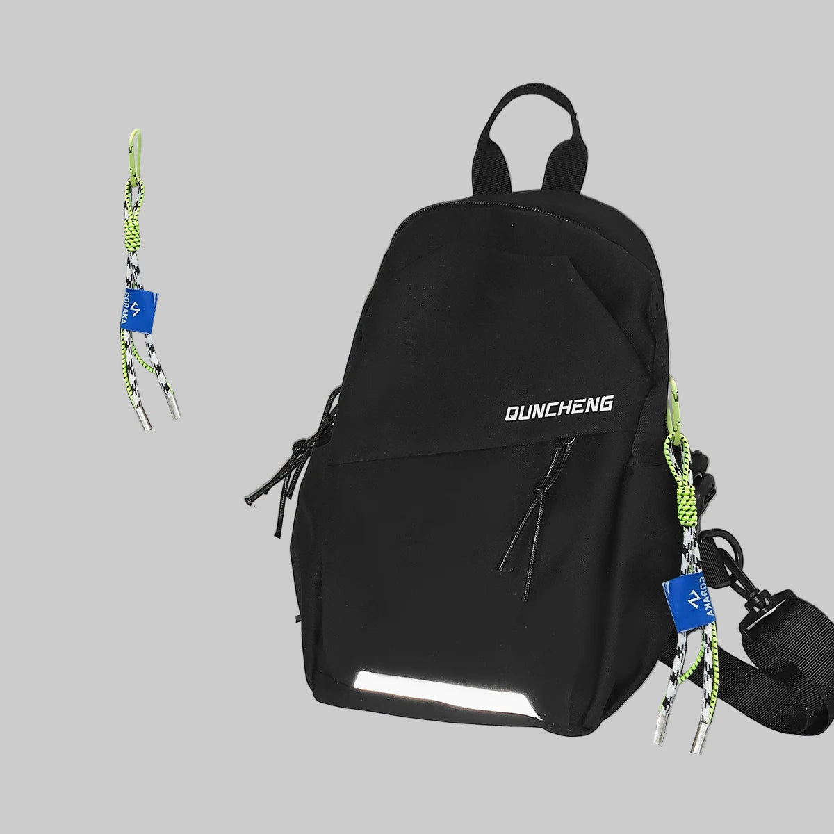 Black backpack with reflective material on a white surface