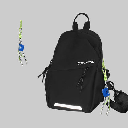 Black backpack with reflective material on a white surface