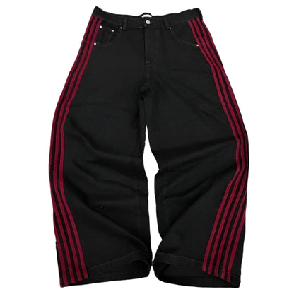Black pants with red stripes on a white background
