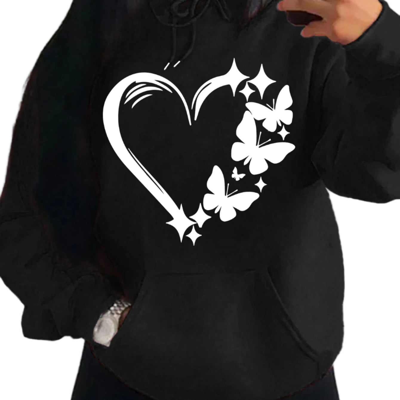 Black hoodie with a heart and butterfly design on a plain background