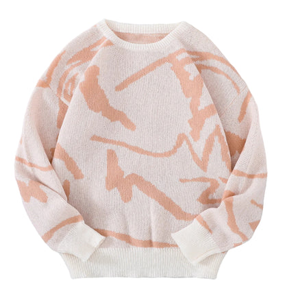 White sweater with pink abstract patterns on a white fur surface