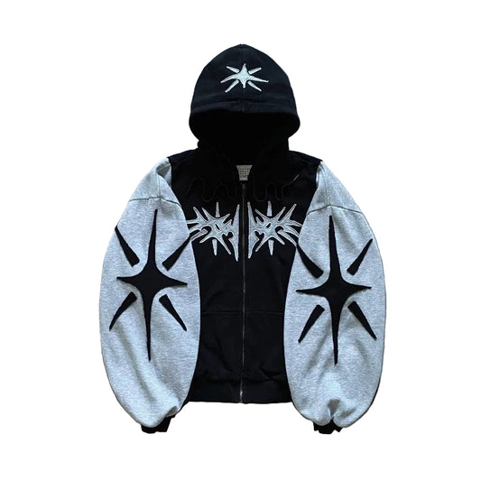 Black and gray hoodie with star designs on a textured surface