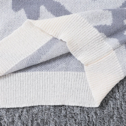 Close-up of a gray and white patterned fabric with a focus on texture.
